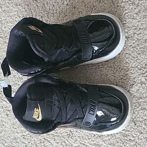 Patent leather black and gold size 6c Jordans